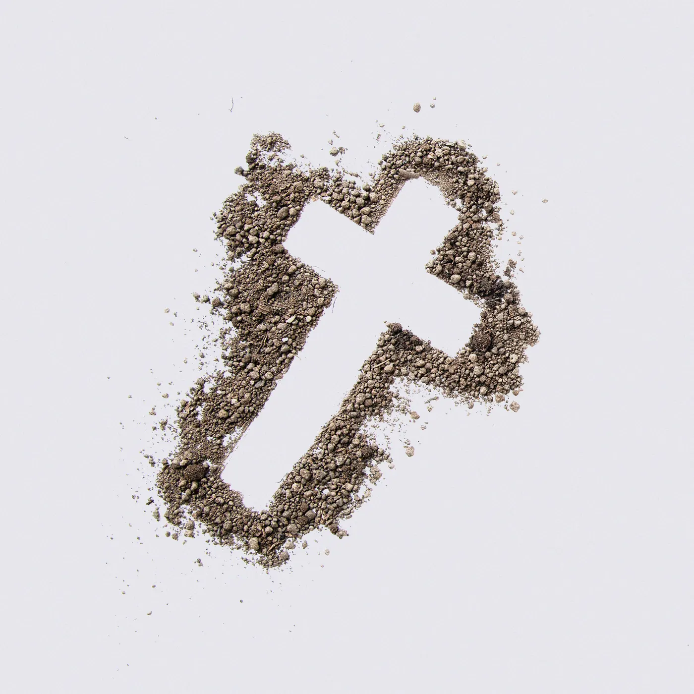 Kreuz aus Asche auf hellem Grund